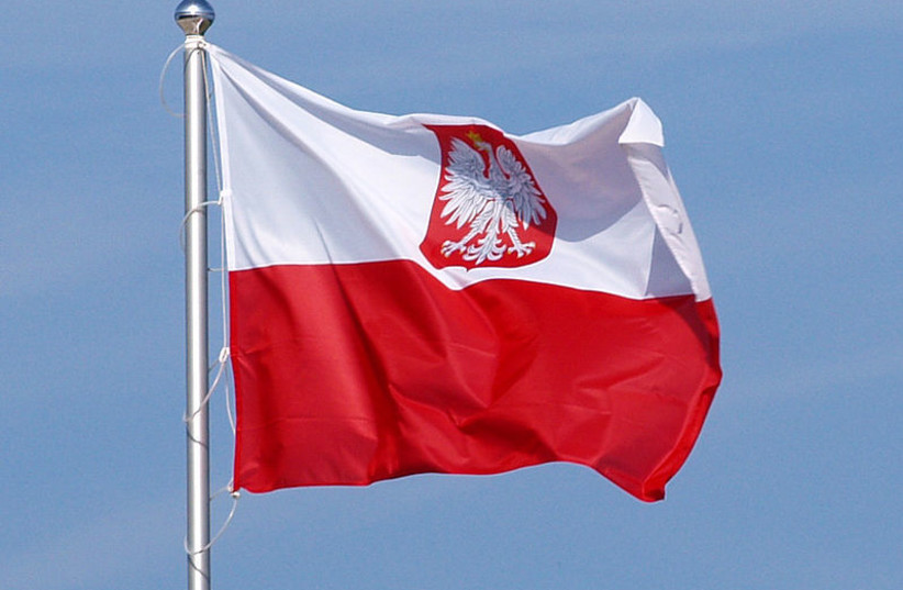 Flag of Poland, variant polish coat of arms. (photo credit: OLEK REMESZ/ WIKEPEDIA COMMONS)