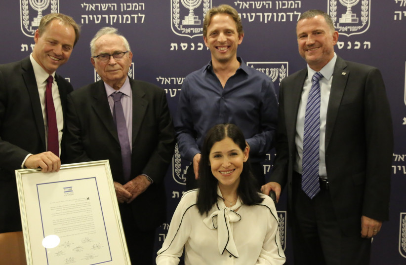 MKs Karin Elharrar and Roi Folkmann (center) win the Israel Democracy Institute's Outstanding Parliamentarian Award, July 17, 2017 (photo credit: ODED ANTMAN)