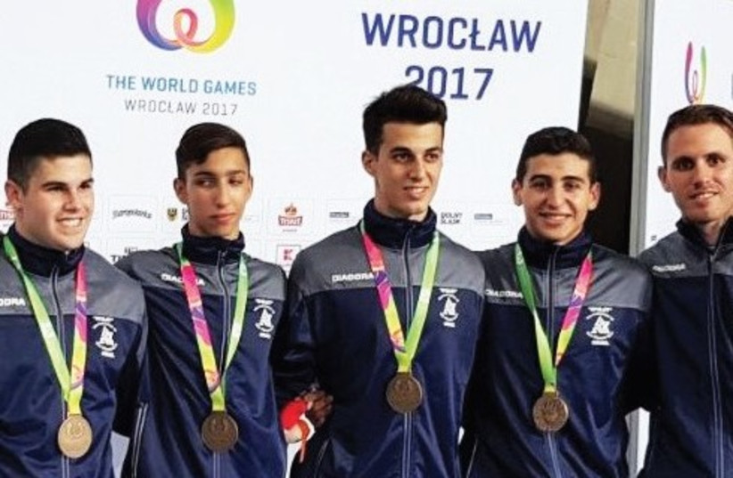 The members of Israel’s acrobatic gymnastics men’s team pose with their bronze medals won in the group all-around event on Wednesday at the World Games in Poland (photo credit: Courtesy)