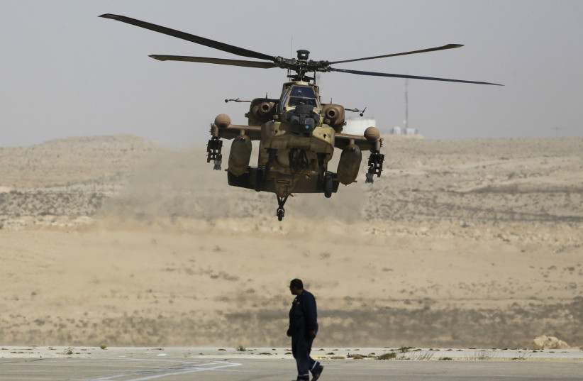 Israeli Apache helicopter lands at Ramon air base (photo credit: AMIR COHEN - REUTERS)