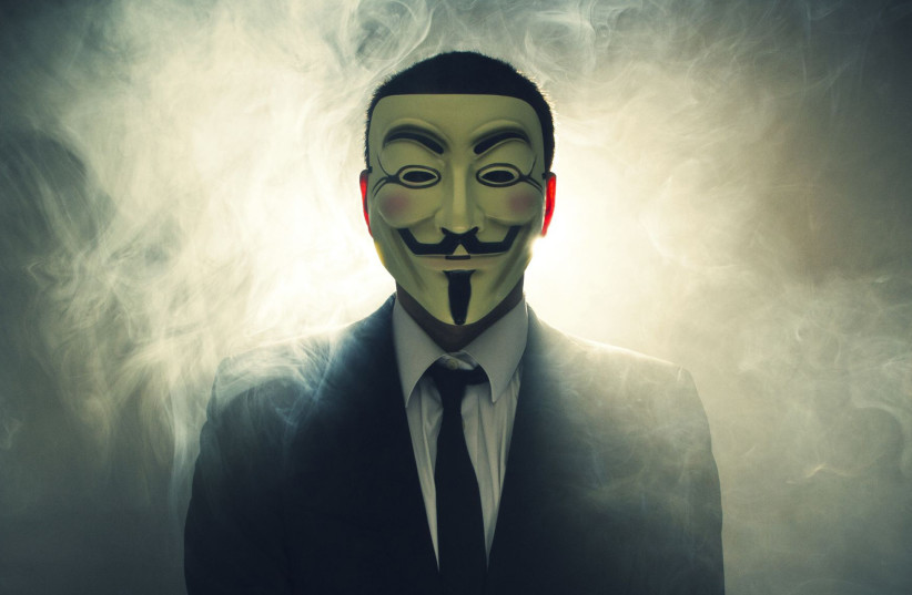 The masked face of international hacker Anonymous (credit: WIKIMEDIA)