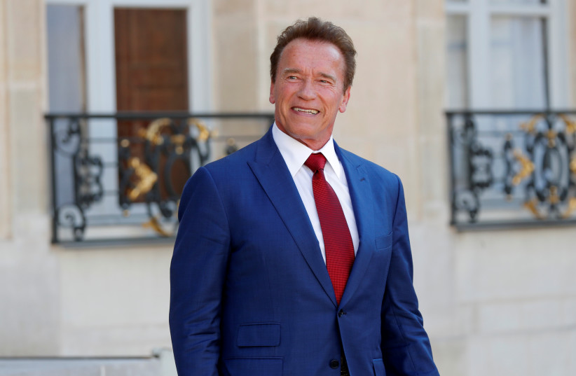 Former California Governor Arnold Schwarzenegger leaves the Elysee Palace in Paris, France (photo credit: CHARLES PLATIAU / REUTERS)