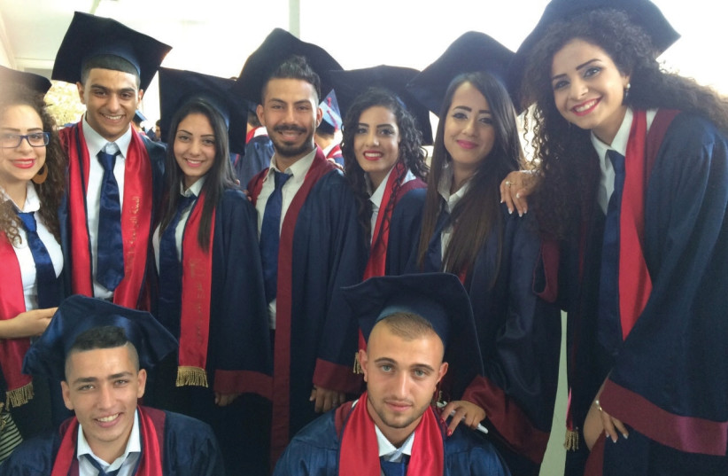 High school graduates celebrate receiving their diplomas in Kafr Yasif last year. (photo credit: SPERO SALAM)