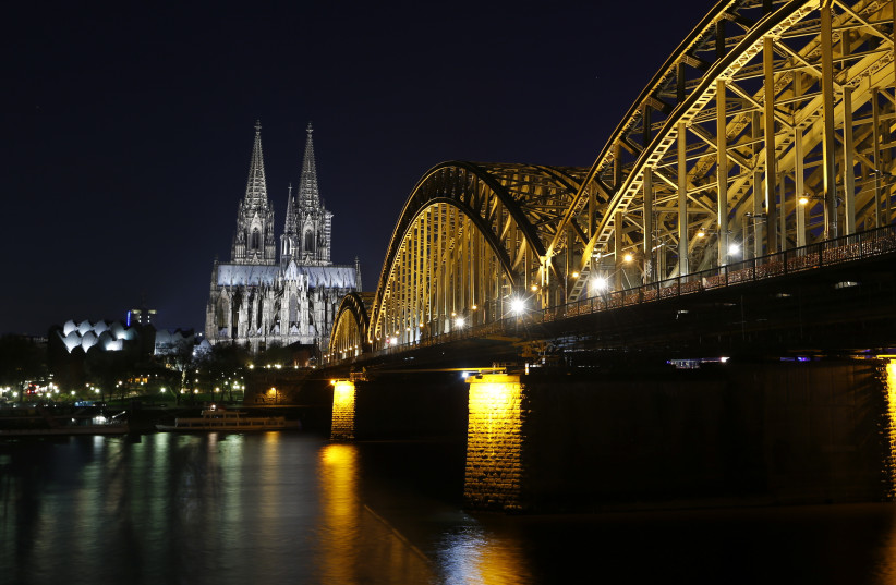 UNESCO World Heritage Cologne Cathedral and the Hohenzollern railway bridge along the Rhine (photo credit: REUTERS/INA FASSBENDER)