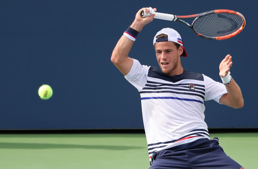 Diego Schwartzman of Argentina hits a forehand against Lucas Pouille of France (not pictured) on day seven of the U.S. Open tennis tournament at USTA Billie Jean King National Tennis Center. (photo credit: GEOFF BURKE-USA TODAY SPORTS/VIA REUTERS)