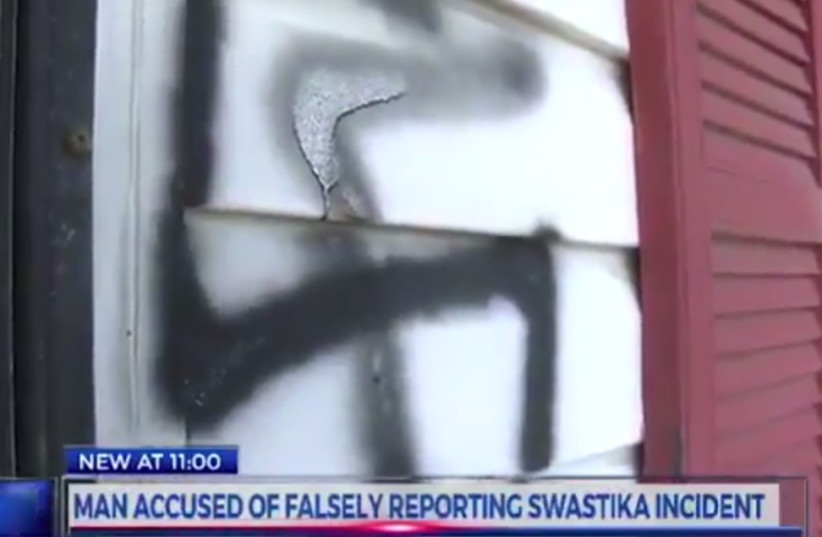A swastika painted on the house of upstate New York resident Andy King (photo credit: YOUTUBE SCREENSHOT)