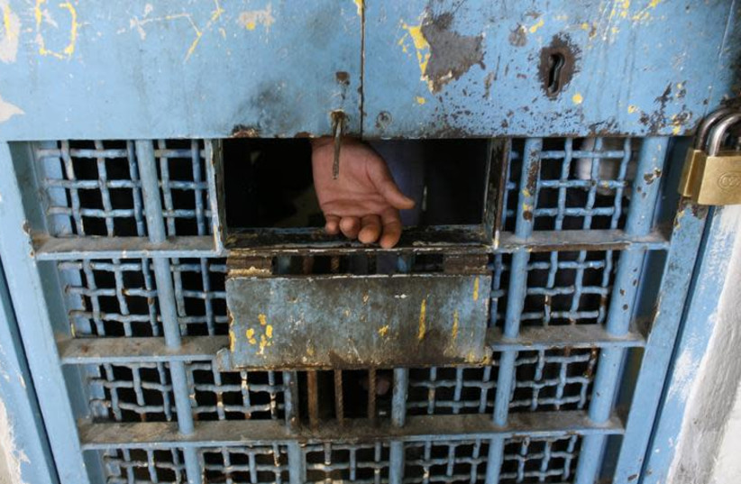 The hand of a Palestinian inmate is seen in a prison in the West Bank city of Nablus February 11, 2008.  (photo credit: ELIANA APONTE/REUTERS)