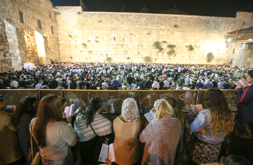 Women reading selichot -- Jewish penitential poems and prayers said leading up to the High Holidays -- at the Western Wall before Rosh Hashana (photo credit: MARC ISRAEL SELLEM)
