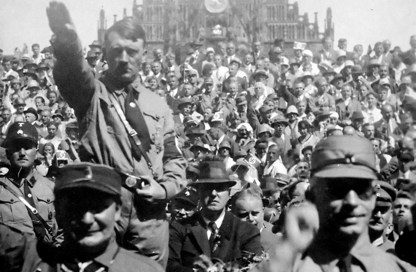 Hitler and Hermann Göring saluting at a 1928 Nazi Party rally in Nuremberg (credit: PUBLIC DOMAIN / HEINRICH HOFFMANN / US NATIONAL ARCHIVES AND RECORDS ADMINISTRATION)