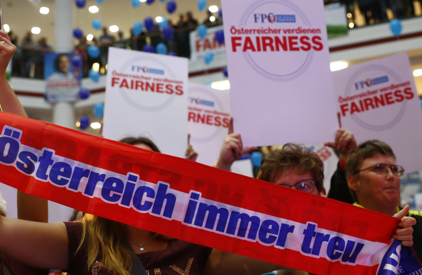 Supporters wait for Head of Austrian far-right Freedom Party (FPO) Heinz-Christian Strache during an election campaign rally in Vienna, Austria (photo credit: REUTERS)