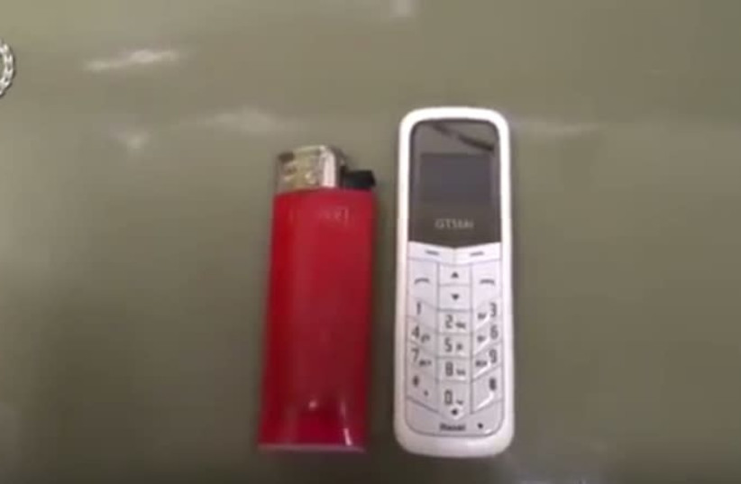 A still image from video released by police of a prison phone smuggling ring. (photo credit: POLICE SPOKESPERSON'S UNIT)