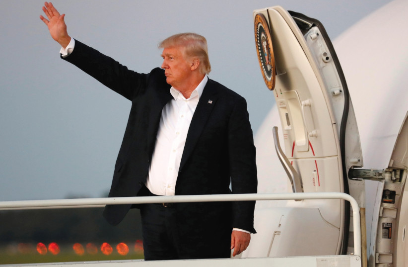 US PRESIDENT Donald Trump waves from Air Force One as he departs Morristown, New Jersey.  (photo credit: REUTERS)