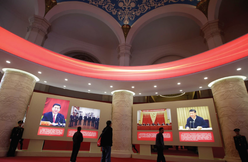 People visit an exhibition displaying China’s achievements over the past five years as part of the celebrations of the upcoming 19th National Congress of the Communist Party of China (CPC) at the Beijing Exhibition Center. (photo credit: REUTERS)