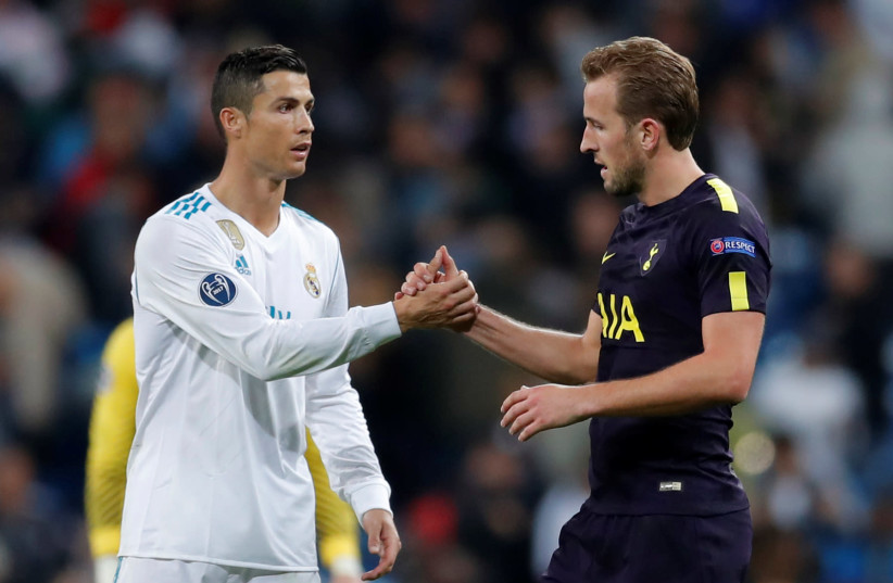 Tottenham's Harry Kane and Real Madrid’s Cristiano Ronaldo shake hands after the match. (photo credit: ANDREW COULDRIDGE/REUTERS)