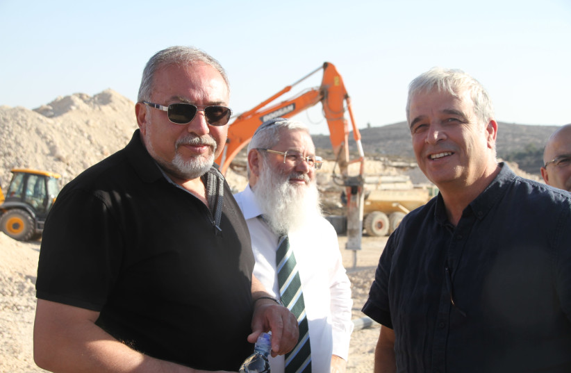 Former Defense Minister Avigdor Liberman, Deputy Defense Minister Eli Dahan and former Settler leader Avi Ro'eh at the site of the new Amihai settlement when it was being built in October 2017. (photo credit: TOVAH LAZAROFF)