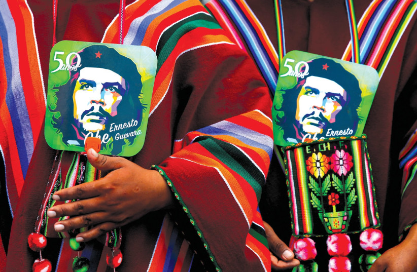 Images of Ernesto ‘Che’ Guevara at a ceremony commemorating the Argentinean revolutionary’s death in Bolivia. (photo credit: DAVID MERCADO/REUTERS)