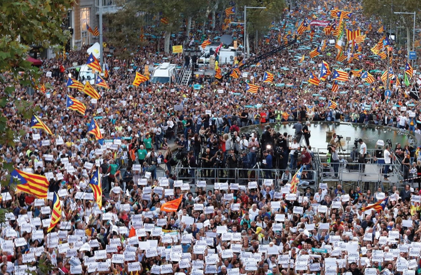 CATALANS MARCH for independence on Saturday  (photo credit: REUTERS)