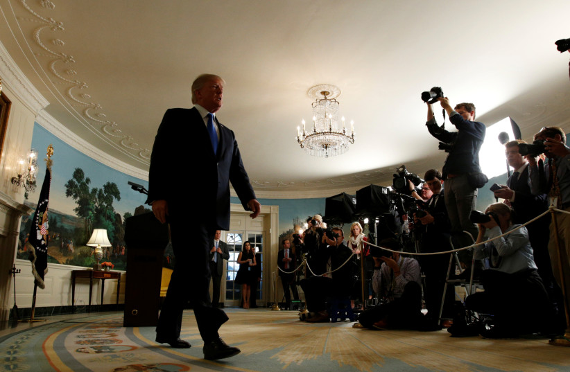 US President Donald Trump walks from the Diplomatic Reception Room after speaking about the Iran nuclear deal at the White House in Washington, US, October 13, 2017.  (photo credit: REUTERS)