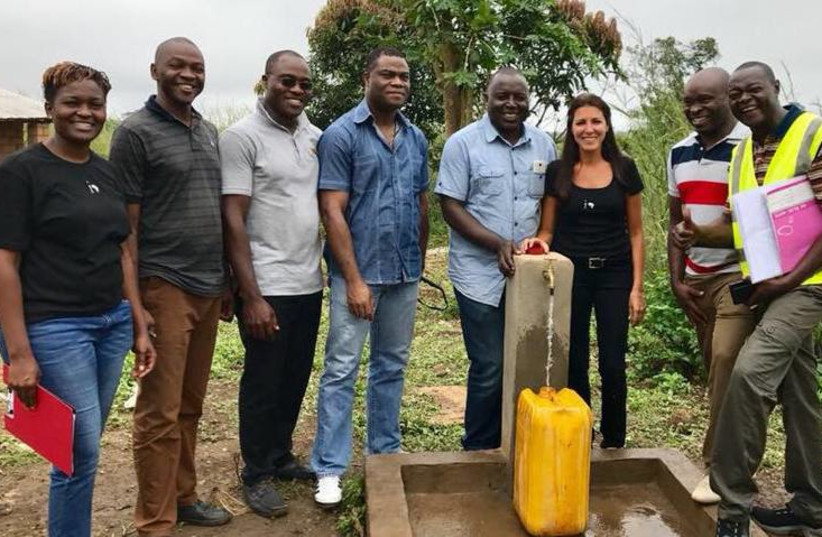 A member of Israel’s Innovation: Africa team installs clean water for a refugee village in Central Africa earlier this year.  (photo credit: INNOVATION:AFRICA)