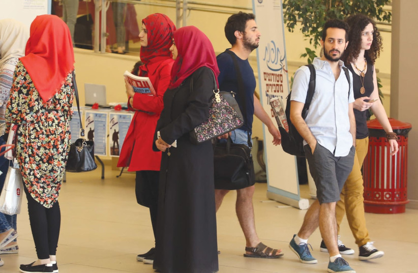 Muslim students are shown in this illustrative photo wearing hijabs at Hebrew University in Jerusalem. (photo credit: MARC ISRAEL SELLEM/THE JERUSALEM POST)