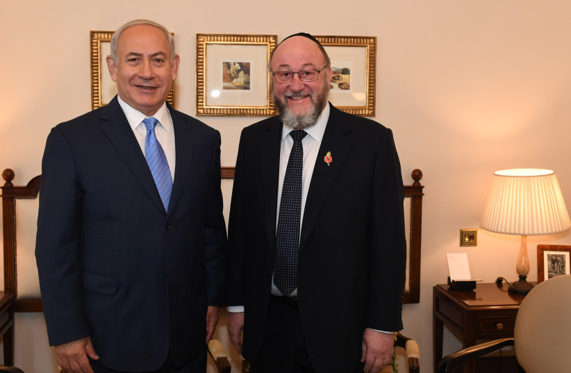 Prime Minister Benjamin Netanyahu meets with Britain's Chief Rabbi Ephraim Mirvis in London (photo credit: KOBI GIDEON/GPO)