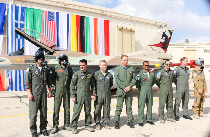 Representatives Israel, France, Greece, United States, Italy, India, Germany and Poland stand in front of an Israeli F16 (photo credit: ANNA AHRONHEIM)