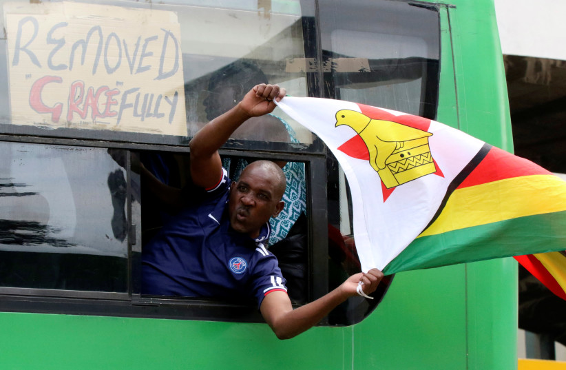 A man calling for Zimbabwean President Robert Mugabe to step down protests in Harare, Zimbabwe (photo credit: REUTERS/PHILIMON BULAWAYO)