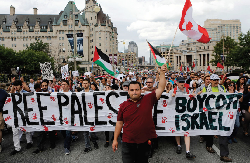 PRO-PALESTINIAN PROTESTERS take part in a demonstration against Israel’s military action in the Gaza Strip, in Ottawa. (credit: REUTERS)