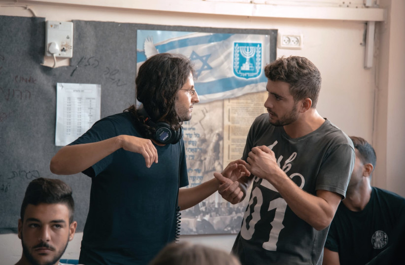 MATAN YAIR (second from left) directs a scene from his debut film ‘Scaffolding.’ (credit: SHADI HABIB ALLAH)
