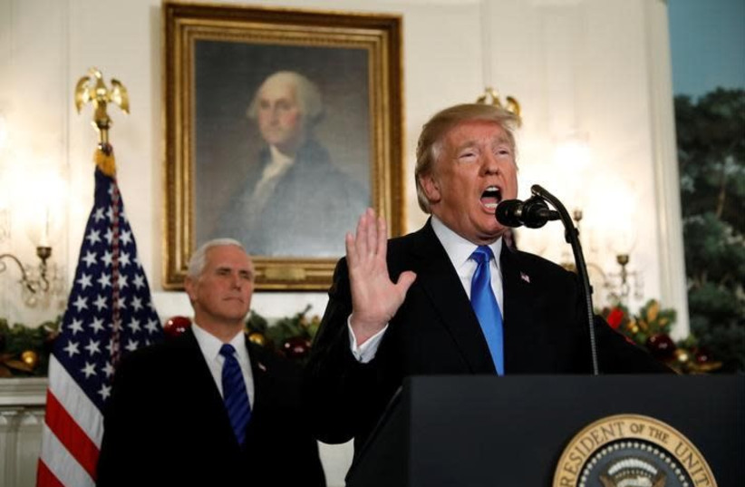 With Vice President Mike Pence looking on, US President Donald Trump gives a statement on Jerusalem, during which he recognized Jerusalem as the capital of Israel, in the Diplomatic Reception Room of the White House in Washington, US, December 6, 2017 (credit: REUTERS/KEVIN LAMARQUE)