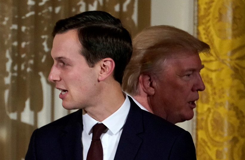 President Donald Trump passes his adviser and son-in-law Jared Kushner during a Hanukkah Reception at the White House (photo credit: KEVIN LAMARQUE/REUTERS)