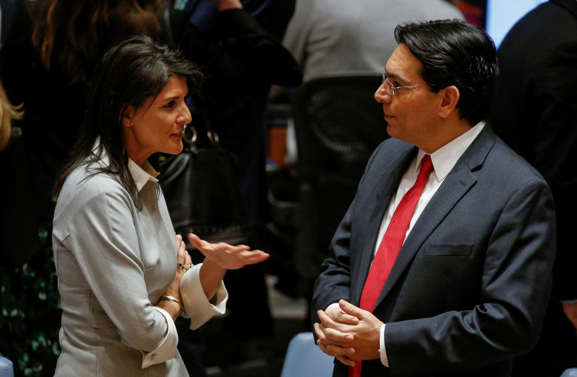 United States ambassador to the United Nations Nikki Haley speaks with Israel's Ambassador to the UN Danny Danon before the start of a UN Security Council meeting on Jerusalem and Palestine in 2017. (photo credit: REUTERS)