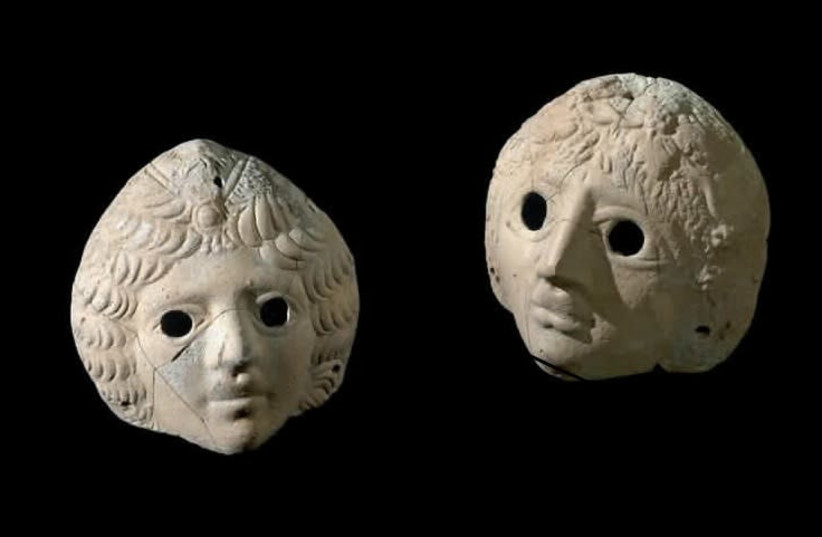 Masks of Dionysus and Ariadne uncovered at the Castra site. (photo credit: CLARA AMIT/IAA)