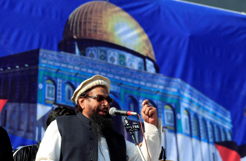 Hafiz Muhammad Saeed (C), chief of the Islamic charity organisation Jamaat-ud-Dawa (JuD), speaks to supporters during a gathering to protest against Trump's decision to recognise Jerusalem as the capital of Israel, in Rawalpindi, Pakistan December (photo credit: REUTERS/FAISAL MAHMOOD)