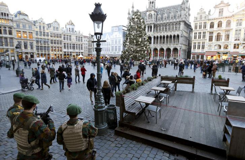 Belgian soldiers stand guard on Brussels' Grand Place (photo credit: REUTERS/FRANCOIS LENOIR)