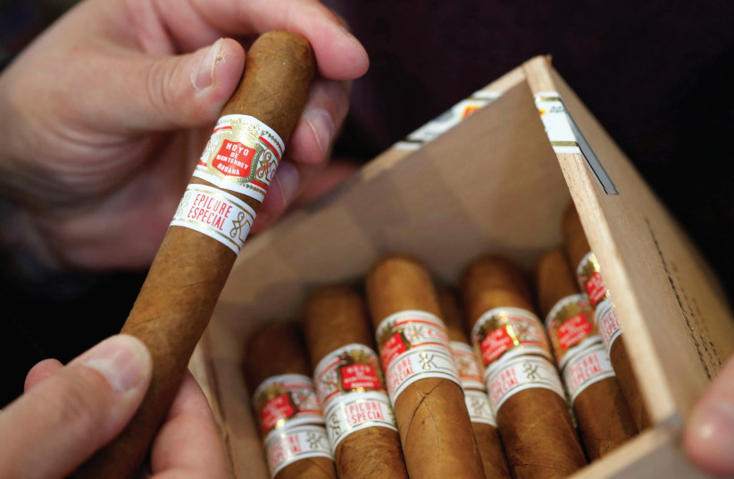 IT ALL starts with a few cigars.  (photo credit: REUTERS)