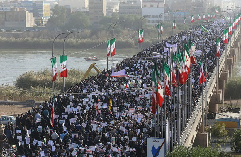 People take part in pro-government rallies, Iran, January 3, 2018. (photo credit: TASNIM NEWS AGENCY/HANDOUT VIA REUTERS)