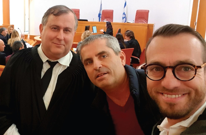 Nachman Rosenberg (right) and Eitan Zeliger (center) pose with Prof. Aviad Hacohen, who is representing Shabbat Team in the petition (photo credit: SHABBAT TEAM)
