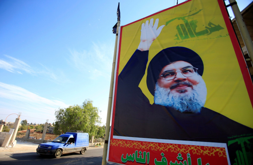 A poster of Hezbollah Secretary-General Hassan Nasrallah in southern Lebanon (photo credit: ALI HASHISHO/REUTERS)