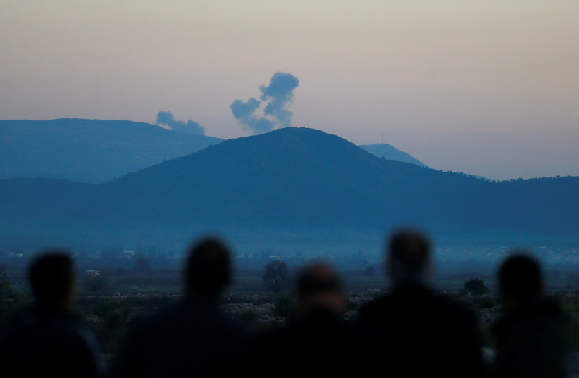 Smoke rises from a target hit by Turkish forces in Afrin, Syria, January 20, 2018 (photo credit: OSMAN ORSAL/REUTERS)