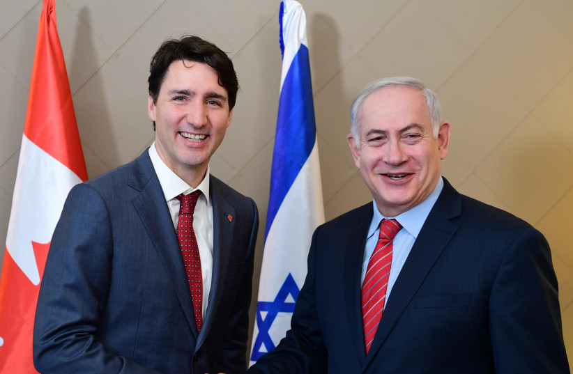 Canadian Prime Minister Justin Trudeau and Israeli Prime Minister Benjamin Netanyahu in Davos, Switzerland. (credit: AMOS BEN-GERSHOM/GPO)