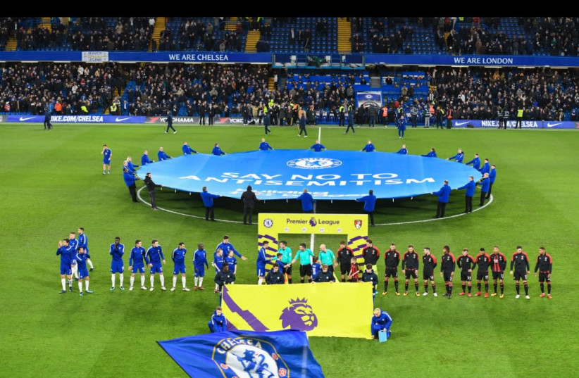 A banner reading "Say No To Antisemitism" is unfurled at midfield before Chelsea F.C.'s match on January 31, 2018, kicking off the club's campaign to fight antisemitism. (photo credit: CHELSEA FOOTBALL CLUB)