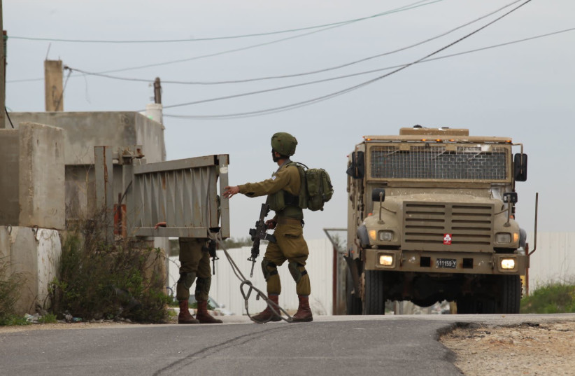 IDF soldiers searching the area after West Bank stabbing attack (photo credit: HILLEL MAEIR/TPS)