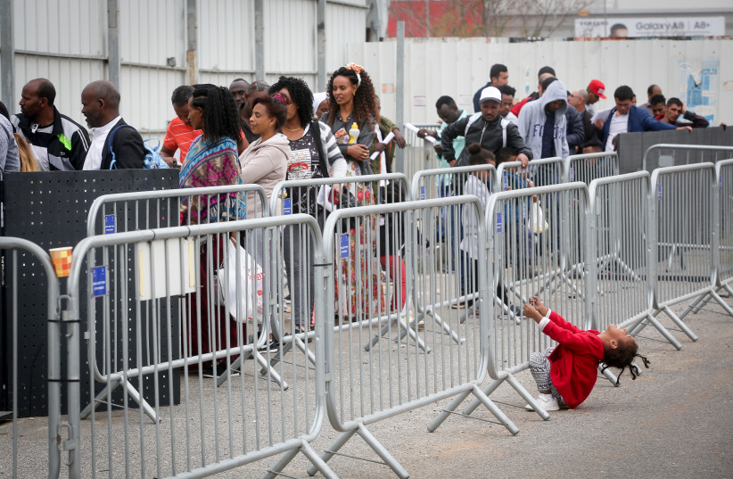 African asylum seekers wait to apply for a visa in Bnei Brak, Israel (photo credit: MARC ISRAEL SELLEM/THE JERUSALEM POST)