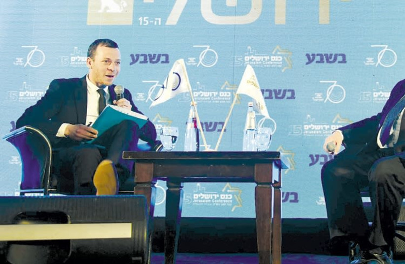President Reuven Rivlin (right) is interviewed by TV journalist Amit Segal yesterday at the 15th annual Jerusalem Conference of the Besheva Group (photo credit: MARK NEIMAN)