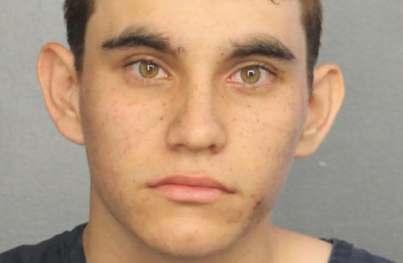 Nikolas Cruz appears in a police booking photo after being charged with 17 counts of premeditated murder following a Parkland school shooting, at Broward County Jail in Fort Lauderdale, Florida, U.S. February 15, 2018. Broward County Sheriff/Handout via REUTERS (photo credit: BROWARD COUNTY SHERIFF/HANDOUT VIA REUTERS)