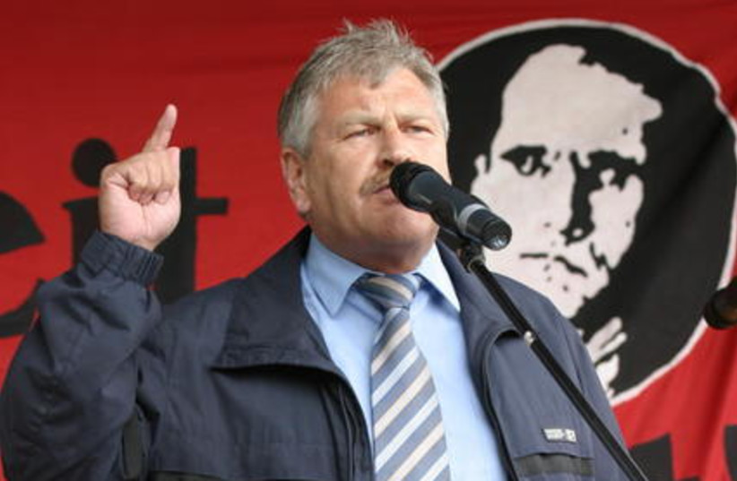 Udo Voigt speaking before a likeness of Rudolf Hess at a march honoring the Nazi official in Wunsiedel in north-western Bavaria  (photo credit: WIKIMEDIA COMMONS MAREK PETERS / WWW.MAREK-PETERS.COM)