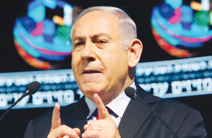 Prime Minister Benjamin Netanyahu addresses a conference in Tel Aviv on February 14 (photo credit: REUTERS/NIR ELIAS)
