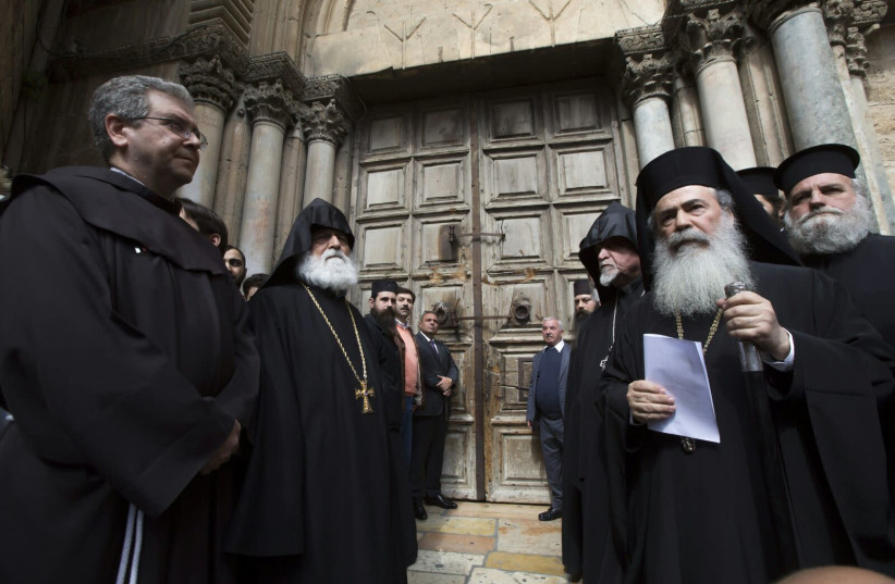 Jerusalem heads of churches in front of the Church of the Holy Sepulchre, which closed over municipality's tax demands on February 25th, 2018. (photo credit: MAB-CTS)