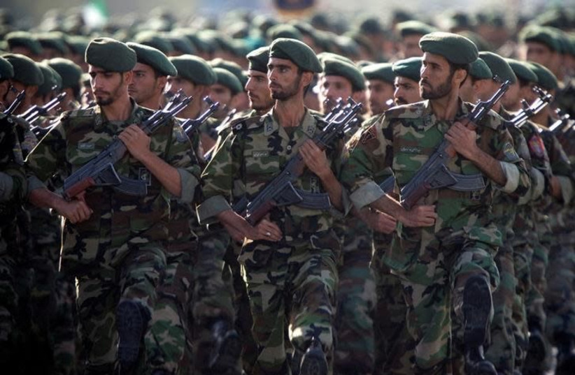 Members of Iran's Revolutionary Guards march during a military parade to commemorate the 1980-88 Iran-Iraq war in Tehran September 22, 2007 (photo credit: REUTERS/MORTEZA NIKOUBAZL)